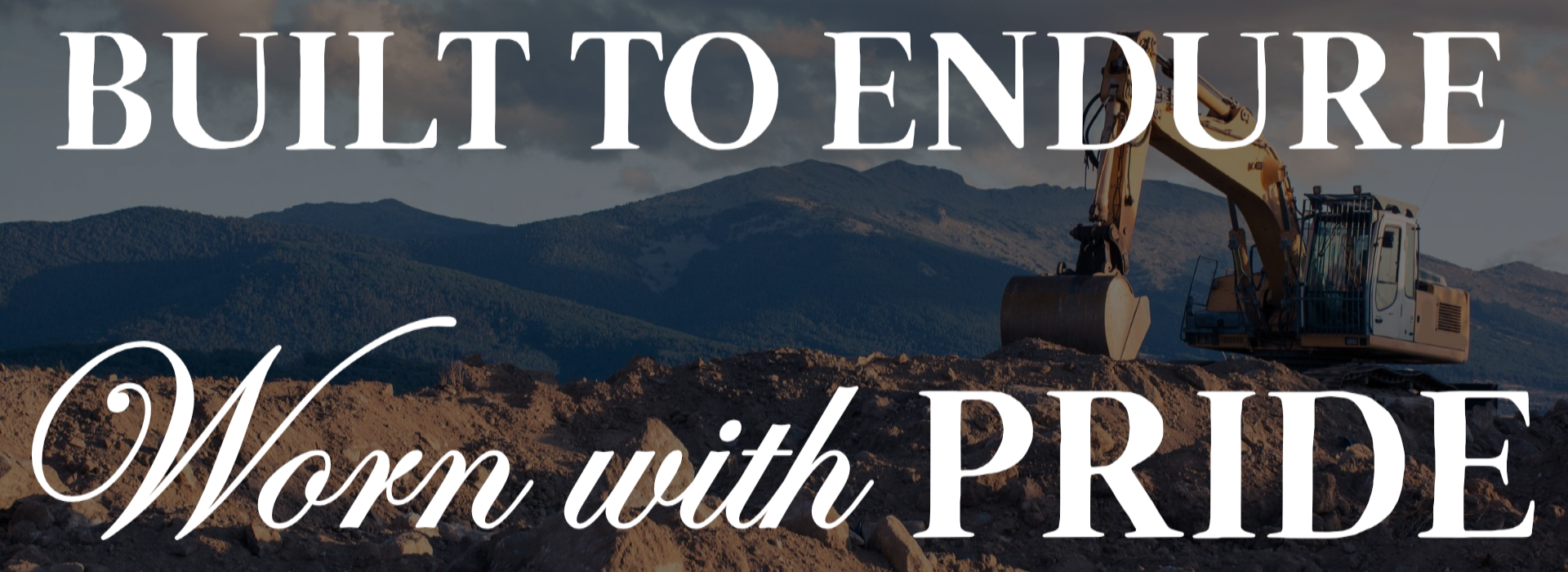 Excavator on a construction site with mountains in the background, featuring text 'Built to Endure, Worn with Pride'.