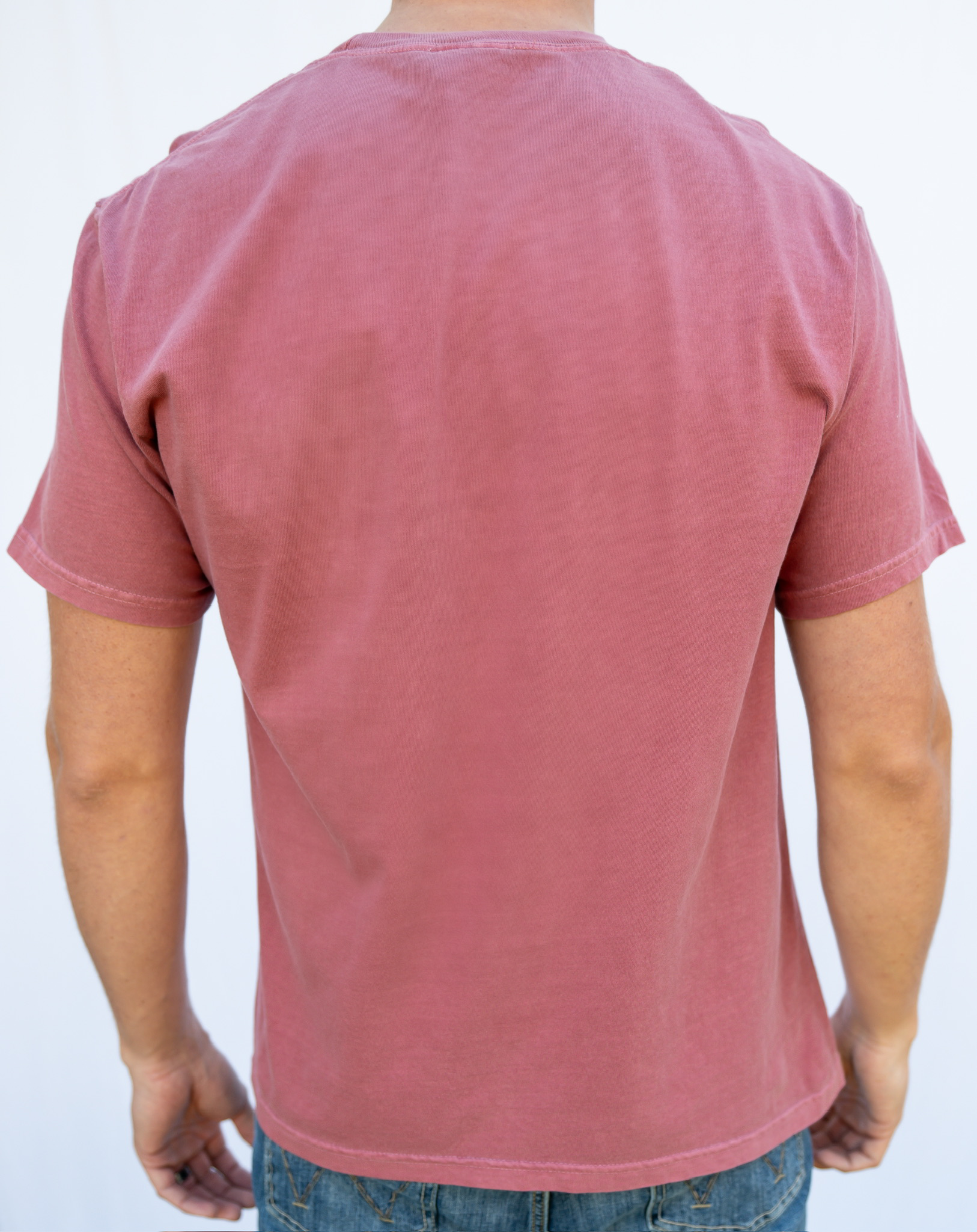 Person wearing a red t-shirt on a white background