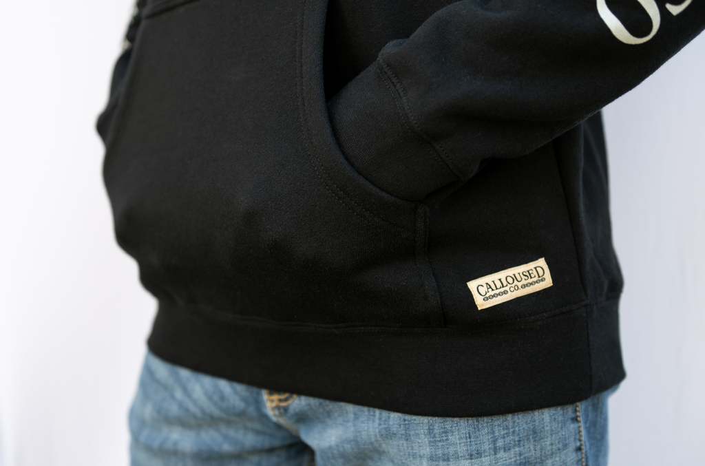 Black hoodie with a visible 'Calloused Co' brand logo on a white background